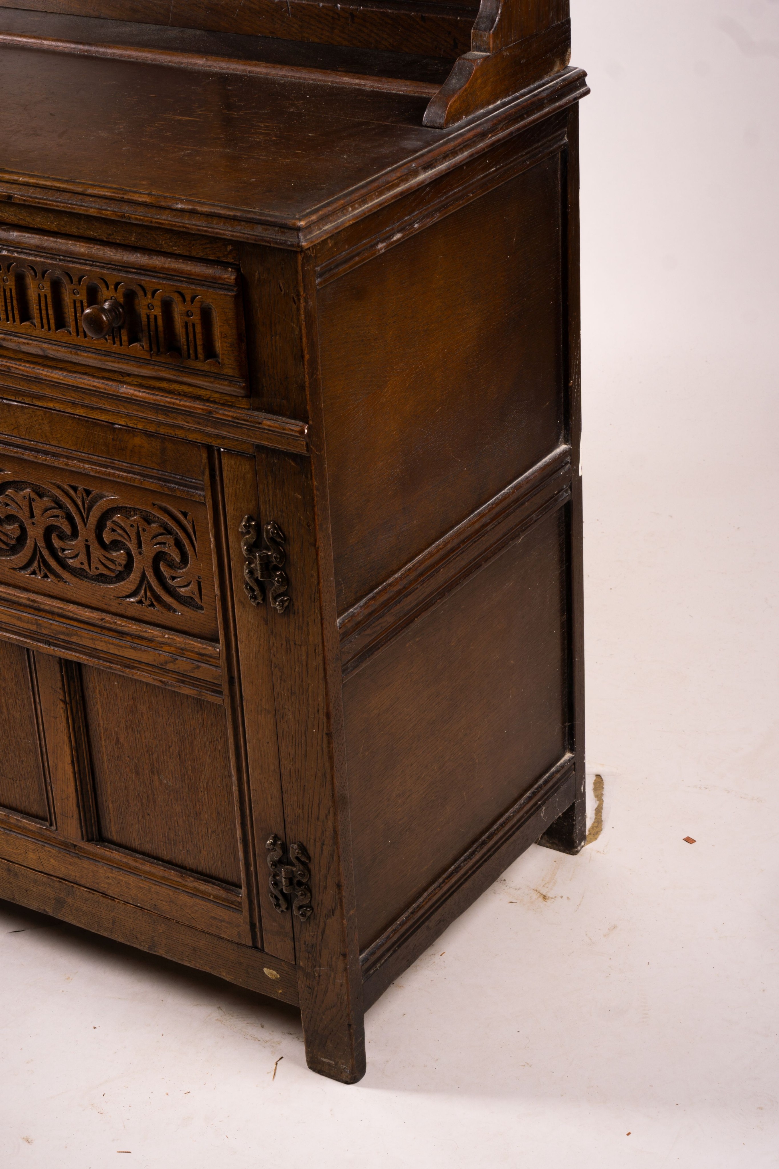 An 18th century style carved oak dresser, width 124cm, depth 46cm, height 175cm